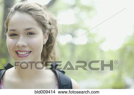 Portrait of a young woman smiling View Large Photo Image Picture - Portrait of a young woman smiling. Fotosearch