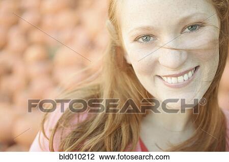 Portrait of a young woman smiling View Large Photo Image Stock Image - Portrait of a young woman smiling. Fotosearch