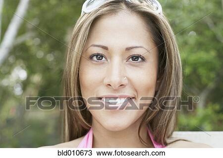 Portrait of a young woman smiling View Large Photo Image Stock Image - Portrait of a young woman smiling. Fotosearch
