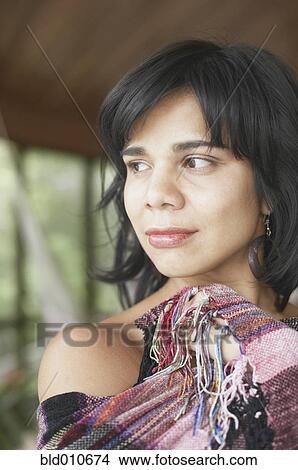 Portrait of a young woman wearing shawl View Large Photo Image Picture - Portrait of a young woman wearing shawl. Fotosearch