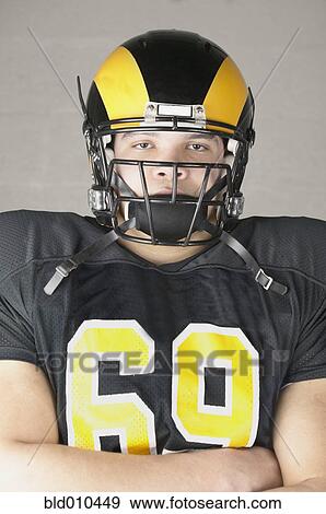 Stock Photo - Portrait of an American football player. Fotosearch