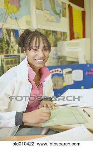 Stock Image - Portrait of female high school student. Fotosearch