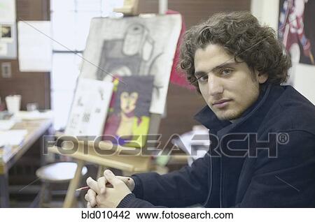 Portrait of teenage boy holding pencil View Large Photo Image Stock Image - Portrait of teenage boy holding pencil. Fotosearch