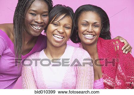 Portrait of three young women smiling View Large Photo Image Stock Photo - Portrait of three young women smiling. Fotosearch