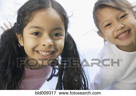 Portrait of two young girls View Large Photo Image Stock Photo - Portrait of two young girls. Fotosearch