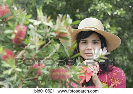 Portrait of woman holding gardening gloves View Large Photo Image Stock Image - Portrait of woman holding gardening gloves. Fotosearch