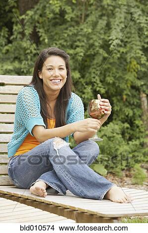 Portrait of woman holding wineglass View Large Photo Image Picture - Portrait of woman holding wineglass. Fotosearch