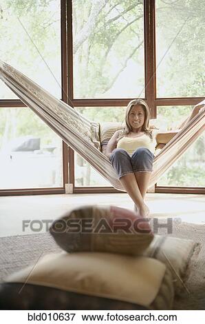 Portrait of woman on hammock View Large Photo Image Stock Photo - Portrait of woman on hammock. Fotosearch