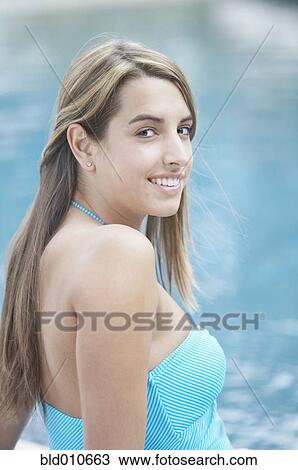 Stock Image - Portrait of young woman in swimwear. Fotosearch