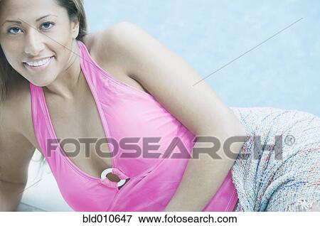 Portrait of young woman reclining View Large Photo Image Stock Photo - Portrait of young woman reclining. Fotosearch