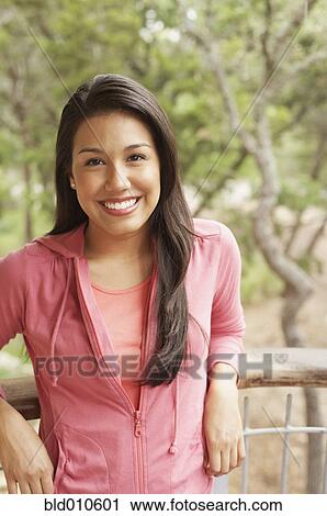 Portrait of young woman smiling View Large Photo Image Stock Image - Portrait of young woman smiling. Fotosearch