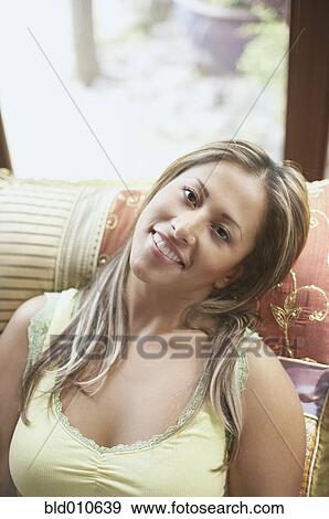 Portrait of young woman smiling View Large Photo Image Stock Photo - Portrait of young woman smiling. Fotosearch