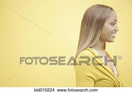Profile of a young woman smiling View Large Photo Image Picture - Profile of a young woman smiling. Fotosearch