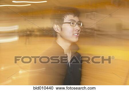 Side view of teenage boy in gymnasium View Large Photo Image Stock Image - Side view of teenage boy in gymnasium. Fotosearch