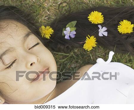 Sleeping girl with flowers in her hair View Large Photo Image Stock Photography - Sleeping girl with flowers in her hair. Fotosearch