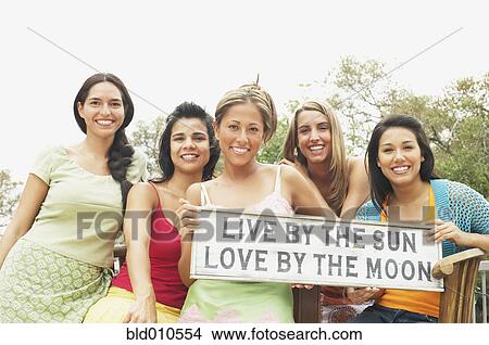 Picture - Small group of women holding sign. Fotosearch