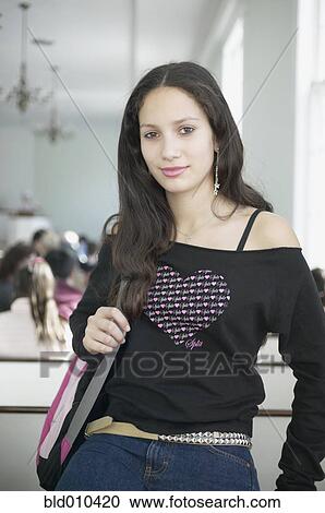 Stock Image - Teenage girl with shoulder bag. Fotosearch