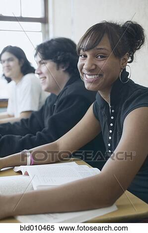 Stock Photography - Three high school students in classroom. Fotosearch