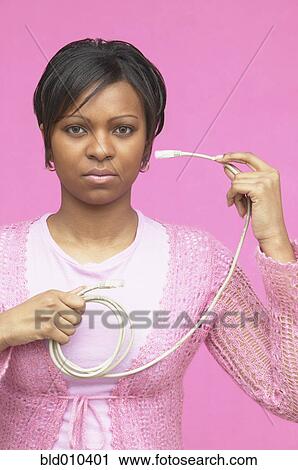 Woman holding computer cable View Large Photo Image Stock Image - Woman holding computer cable. Fotosearch