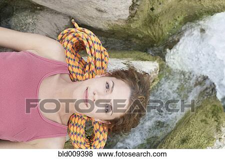 Woman resting her head on a rock View Large Photo Image Stock Photo - Woman resting her head on a rock. Fotosearch