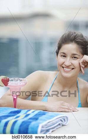 Woman standing in swimming pool View Large Photo Image Stock Photo - Woman standing in swimming pool. Fotosearch