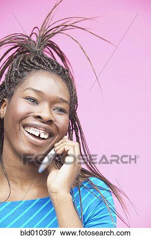 Stock Photo - Woman talking on mobile phone. Fotosearch