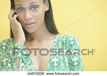 Woman with hand in her hair View Large Photo Image Stock Photograph - Woman with hand in her hair. Fotosearch