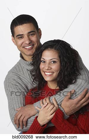 Stock Photo - Young couple embracing. Fotosearch