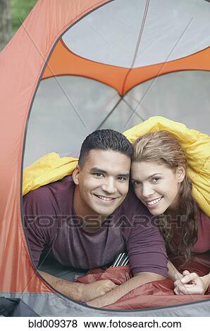 Young couple in a tent View Large Photo Image Stock Photo - Young couple in a tent. Fotosearch