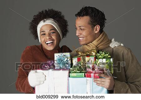 Stock Photo - Young couple with gifts. Fotosearch