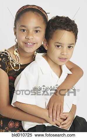 Young sister and brother hugging View Large Photo Image Stock Photography - Young sister and brother hugging. Fotosearch