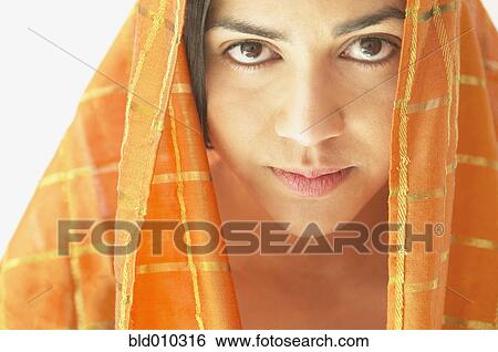 Young woman wearing a head scarf View Large Photo Image Stock Photograph - Young woman wearing a head scarf. Fotosearch
