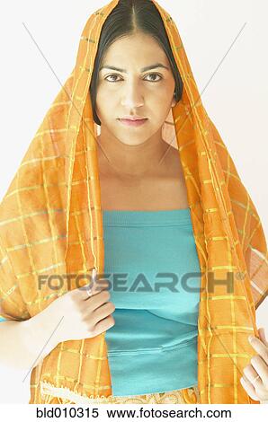 Stock Photography - Young woman wearing a head scarf. Fotosearch