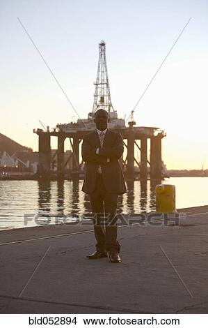 African American businessman on commercial pier View Large Photo Image Picture - African American businessman on commercial pier. Fotosearch