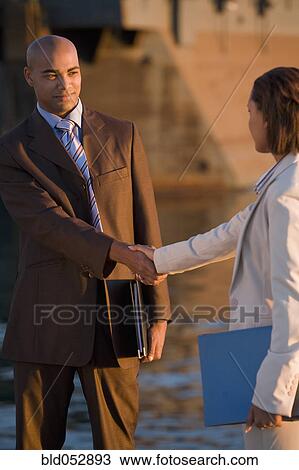 African American businesspeople shaking hands View Large Photo Image Stock Image - African American businesspeople shaking hands. Fotosearch