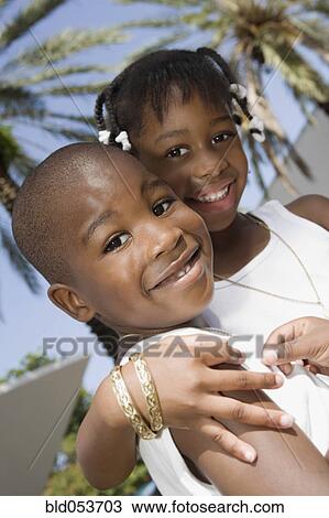 African brother and sister hugging View Large Photo Image Stock Image - African brother and sister hugging. Fotosearch