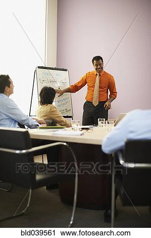 Stock Image - African businessman giving presentation. Fotosearch