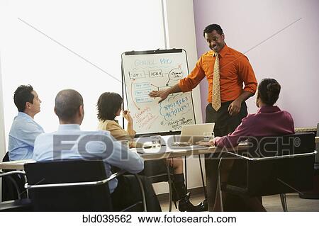 Stock Image - African businessman giving presentation. Fotosearch