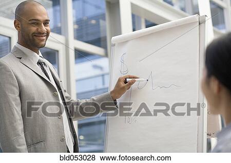 African businessman giving presentation View Large Photo Image Stock Photo - African businessman giving presentation. Fotosearch