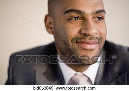 African businessman looking to side View Large Photo Image Stock Photo - African businessman looking to side. Fotosearch