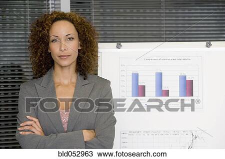 Stock Image - African businesswoman giving presentation. Fotosearch