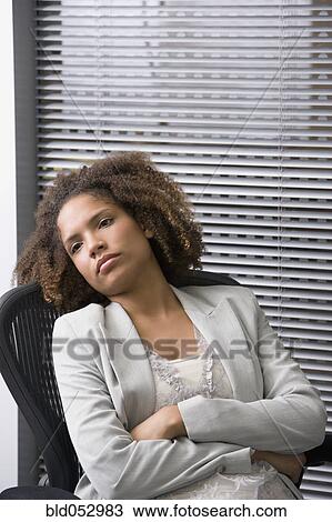 African businesswoman sitting in chair View Large Photo Image Stock Image - African businesswoman sitting in chair. Fotosearch