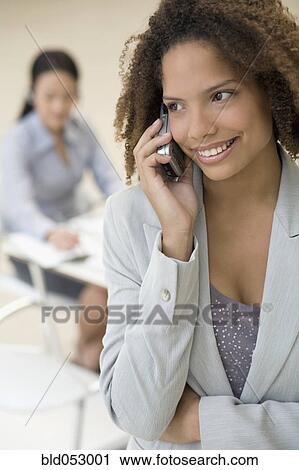 African businesswoman talking on cell phone View Large Photo Image Stock Image - African businesswoman talking on cell phone. Fotosearch