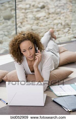 African businesswoman talking on cell phone View Large Photo Image Stock Photo - African businesswoman talking on cell phone. Fotosearch