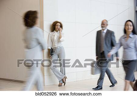 Stock Photograph - African businesswoman talking on cell phone. Fotosearch