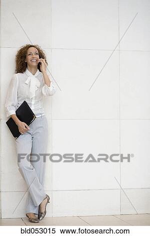African businesswoman talking on cell phone View Large Photo Image Stock Photography - African businesswoman talking on cell phone. Fotosearch