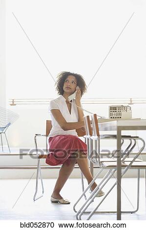 African businesswoman talking on telephone View Large Photo Image Stock Image - African businesswoman talking on telephone. Fotosearch