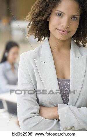 Stock Photo - African businesswoman with arms crossed. Fotosearch