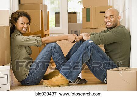 Stock Photo - African couple in new house. Fotosearch