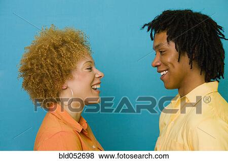 Stock Photo - African couple smiling at each other. Fotosearch
